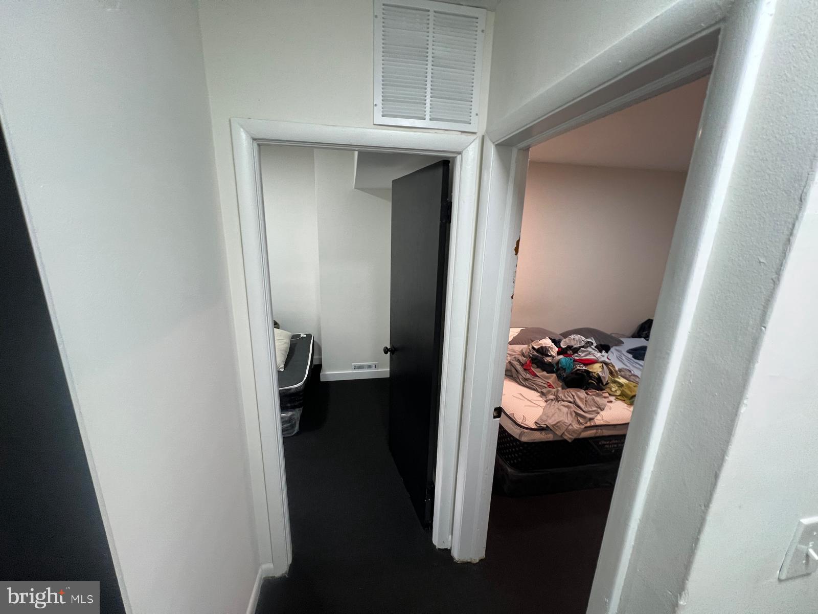 3711 10th Street Baltimore, MD 21225 - Photo 11 of 25 a bed room with a bed and a closet