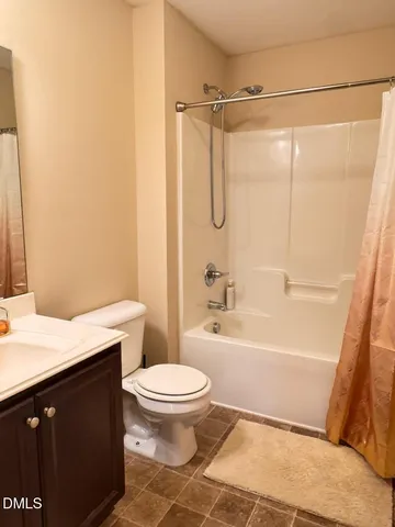 a bathroom with a sink a toilet and a bathtub