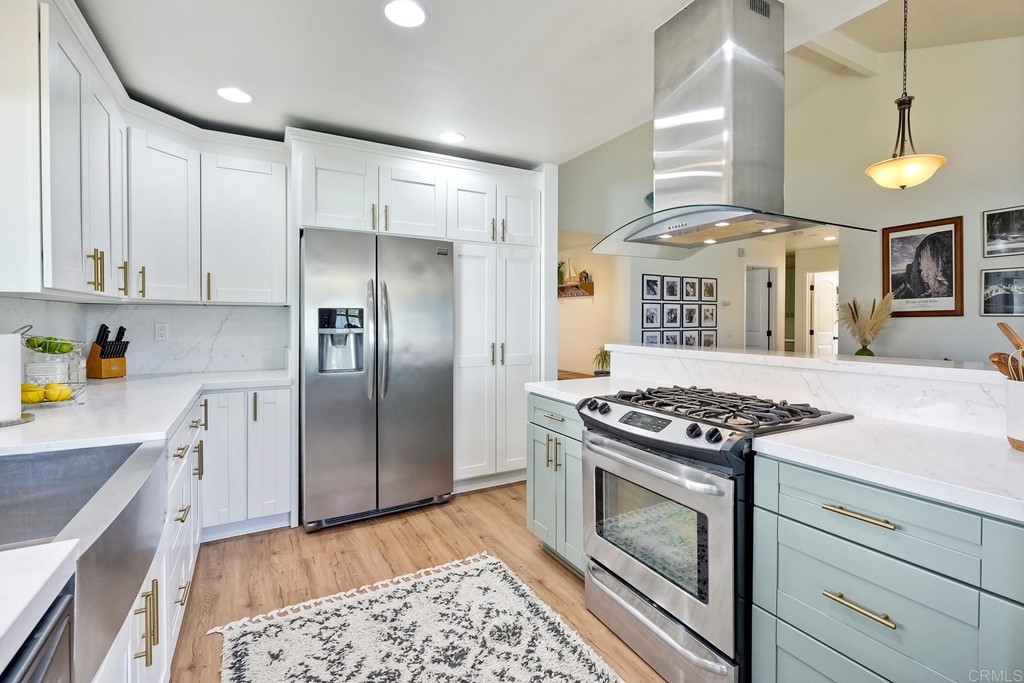 3709 Forest Road Oceanside, CA 92058 - Photo 1 of 1 a kitchen with stainless steel appliances granite countertop a stove a refrigerator and a refrigerator