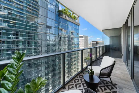 a view of a balcony with chairs