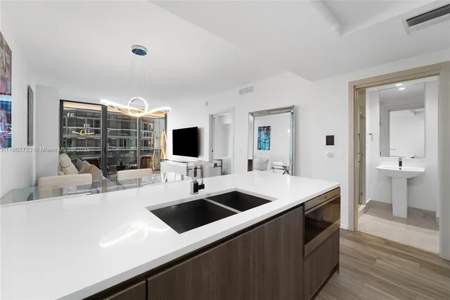 a view of living room with granite countertop furniture and a flat screen tv