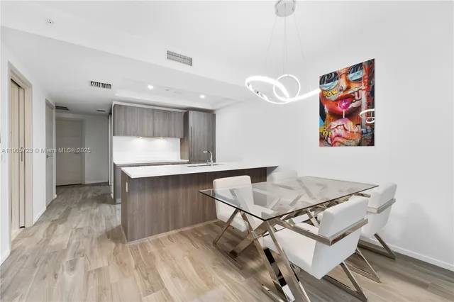 a room with a table and chairs