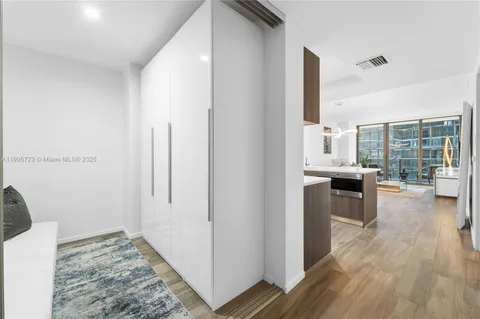a view of a kitchen from the hallway