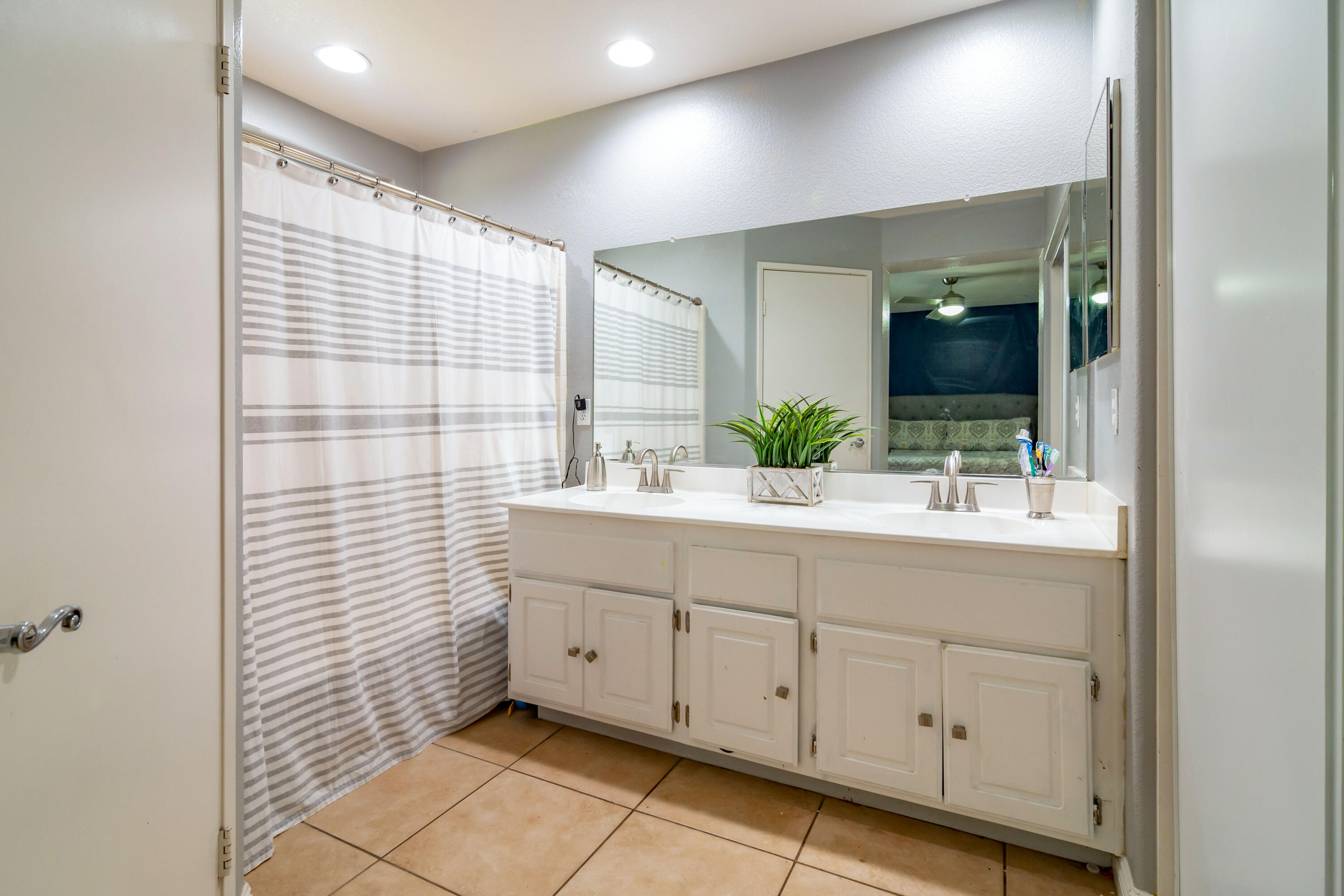 83290 Antigua Drive Indio, CA 92201 - Photo 18 of 31 a bathroom with a sink and a mirror