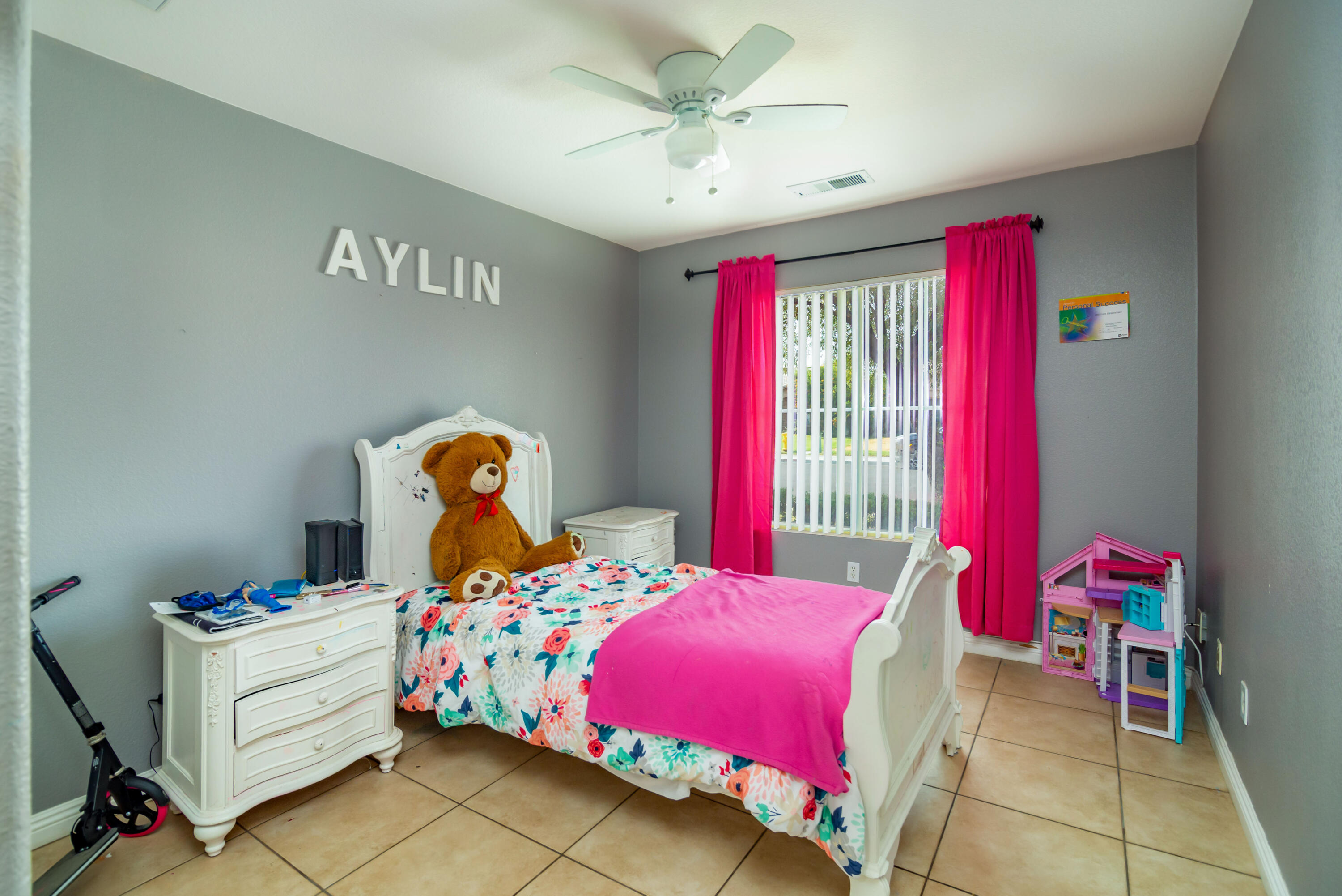 83290 Antigua Drive Indio, CA 92201 - Photo 21 of 31 a bedroom with a bed and a chandelier