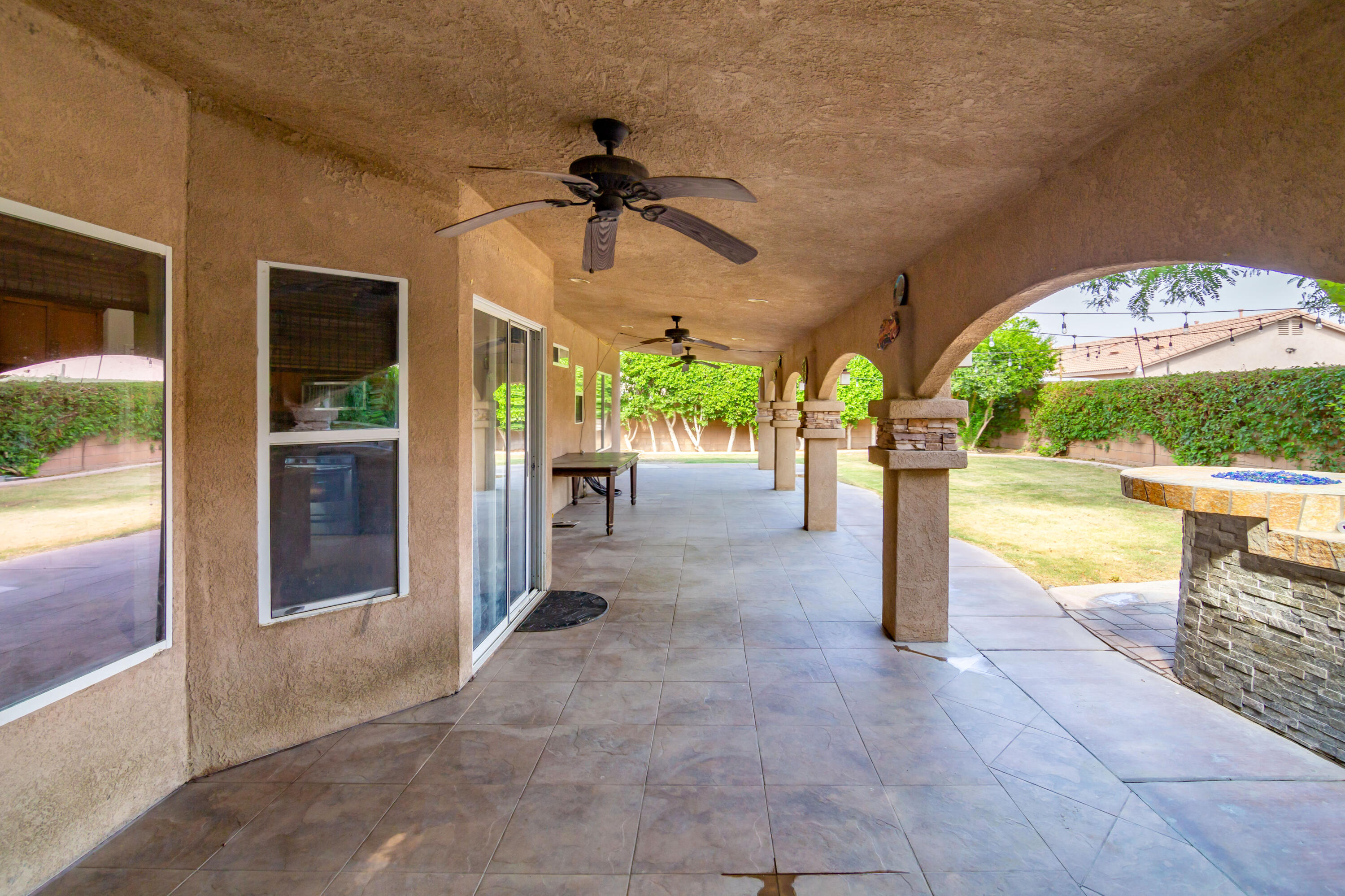 83290 Antigua Drive Indio, CA 92201 - Photo 23 of 31 a view of an chairs and a room with a swimming pool