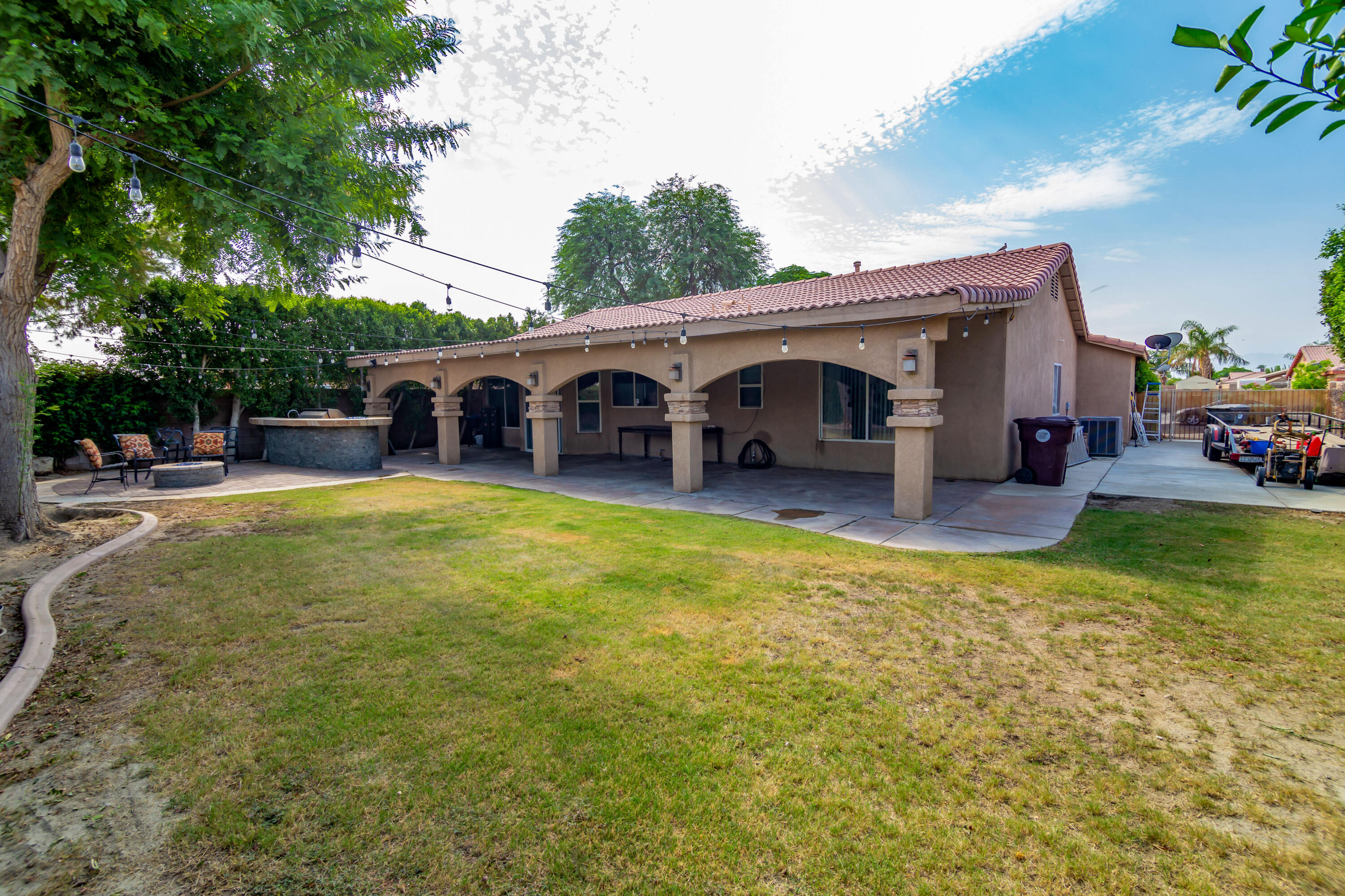 83290 Antigua Drive Indio, CA 92201 - Photo 30 of 31 a view of a house with swimming pool and porch