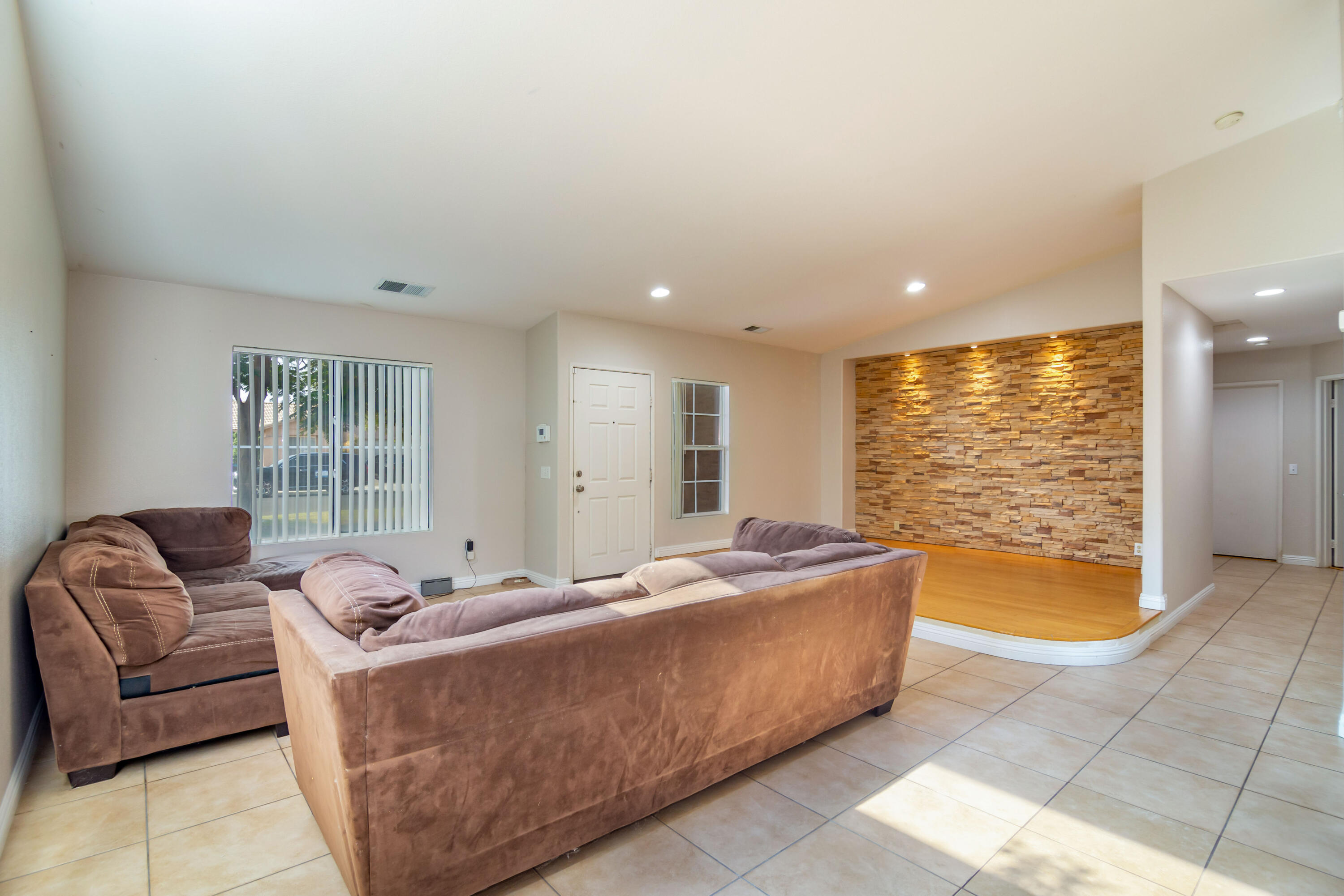 83290 Antigua Drive Indio, CA 92201 - Photo 7 of 31 a living room with furniture and a large window