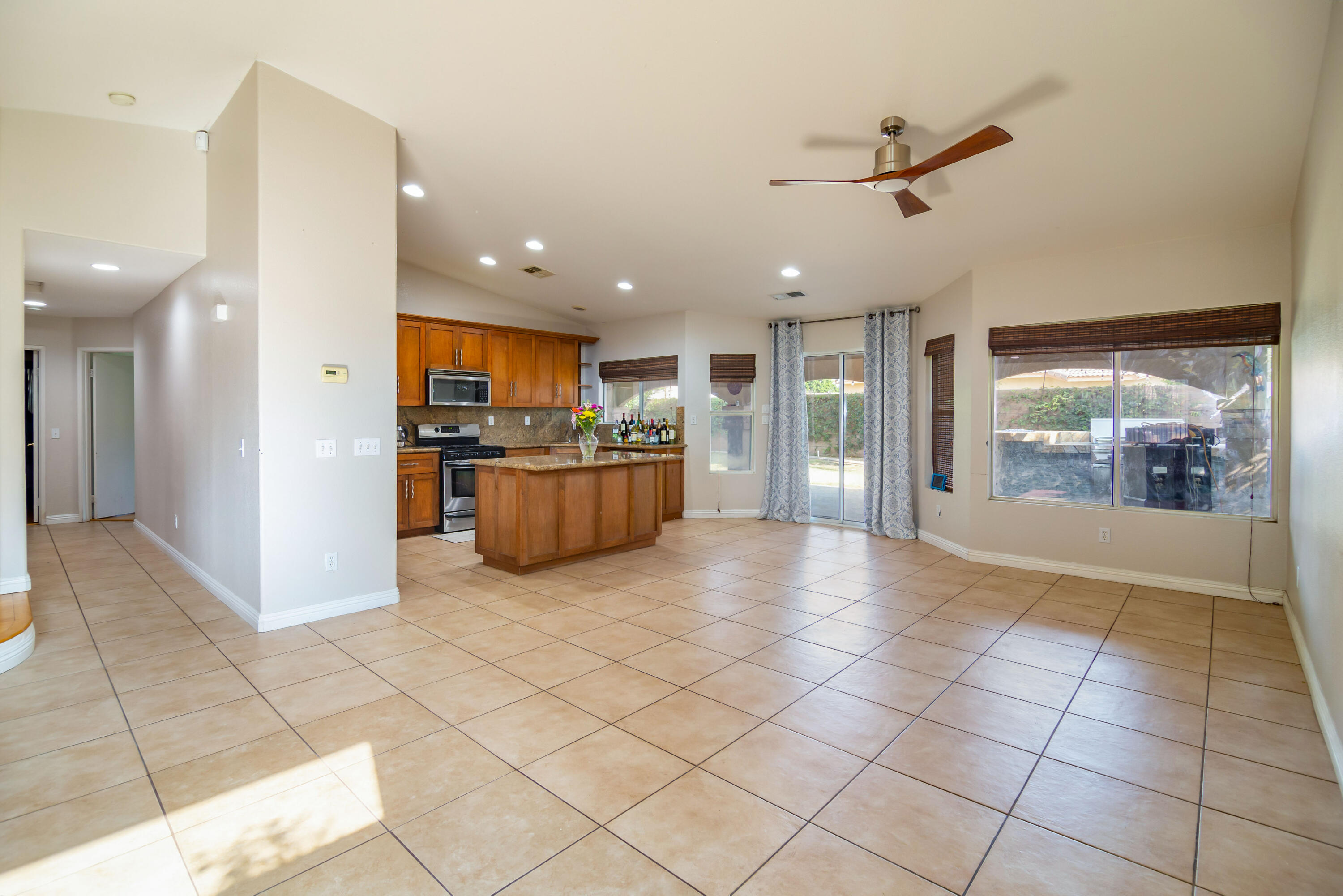 83290 Antigua Drive Indio, CA 92201 - Photo 9 of 31 a view of a kitchen with furniture and a refrigerator