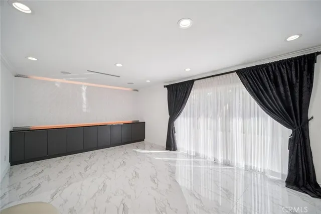 a bathroom with a glass shower door and a toilet