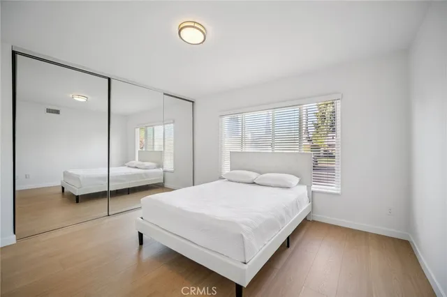 a kitchen with stainless steel appliances kitchen island wooden cabinets and granite counter tops