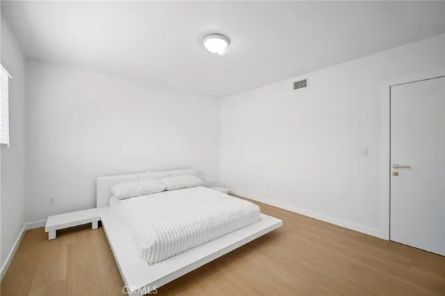 a spacious bathroom with a sink and a mirror