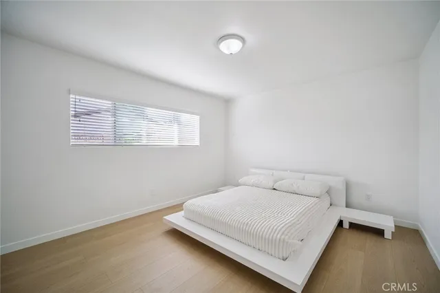 a view of a livingroom with workspace and a window