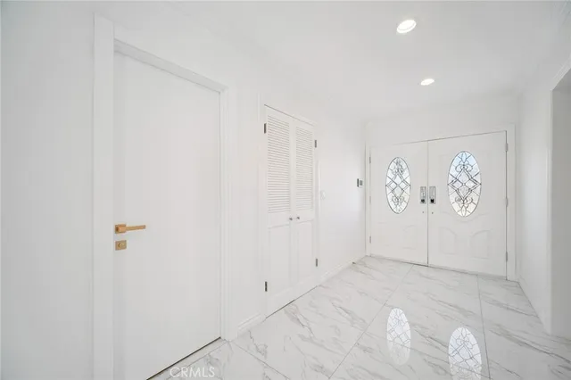 a kitchen with stainless steel appliances kitchen island granite countertop a stove a sink a dining table and chairs