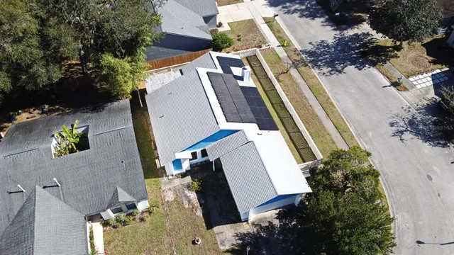 an aerial view of residential house with outdoor space
