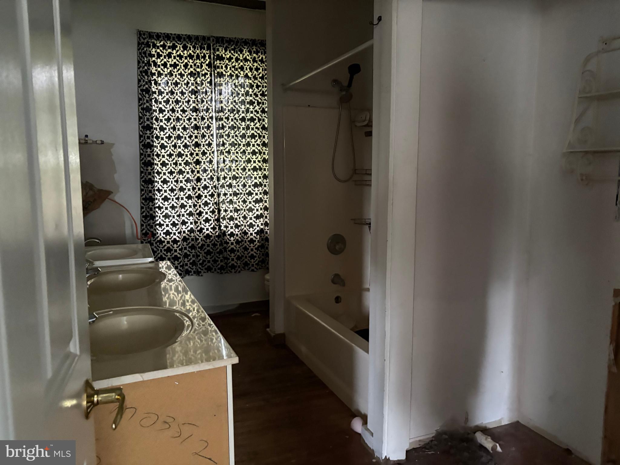 309 South Main Street Hurlock, MD 21643 - Photo 22 of 53 a bathroom with a sink toilet and shower