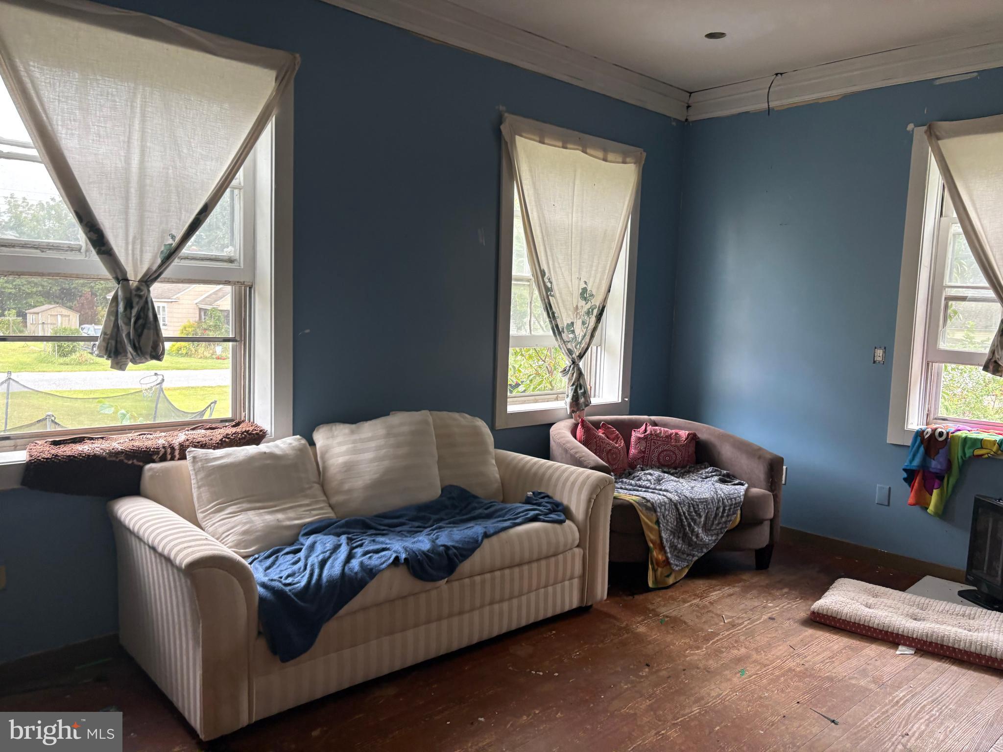 309 South Main Street Hurlock, MD 21643 - Photo 23 of 53 a living room with furniture and a large window