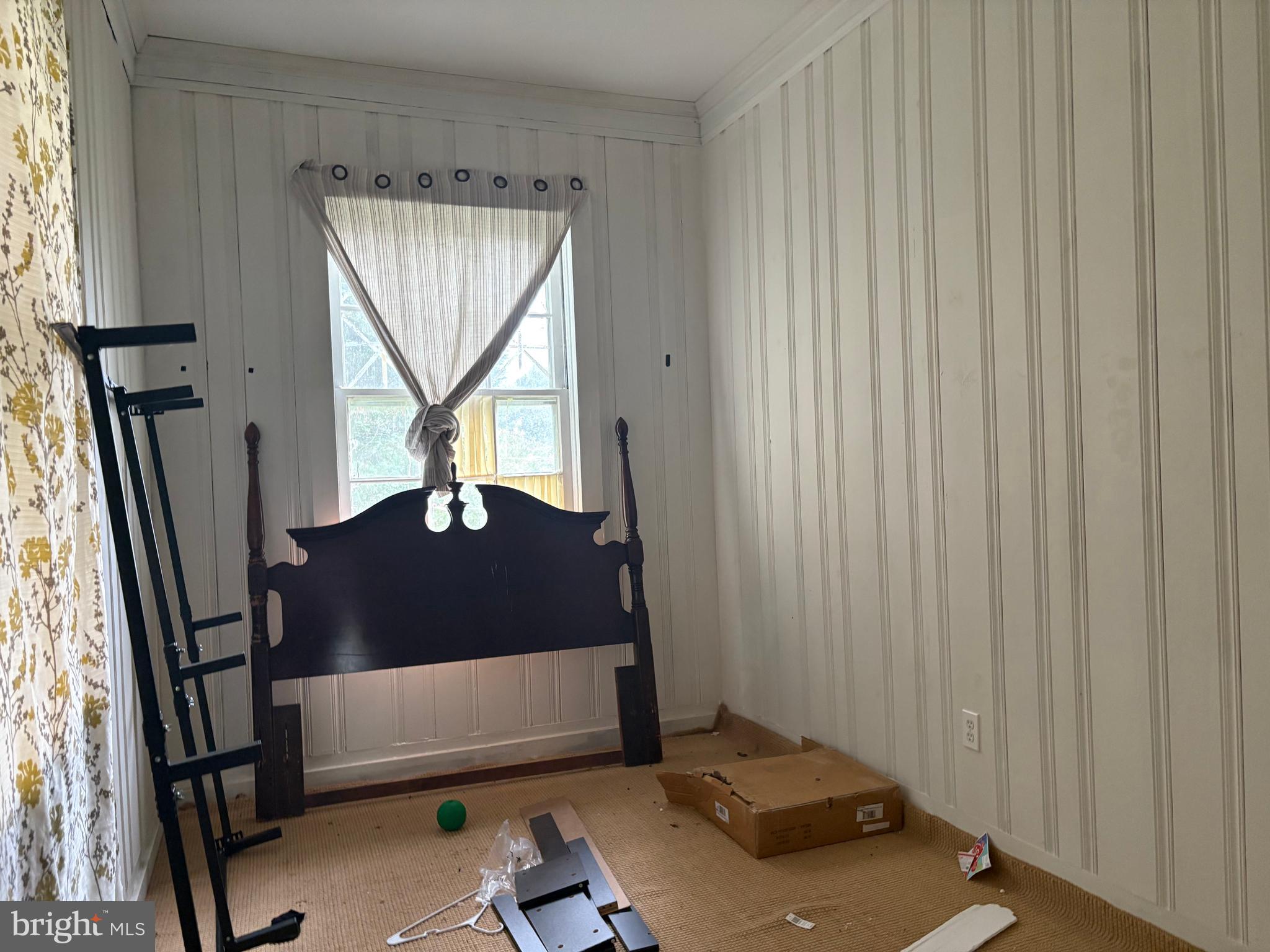 309 South Main Street Hurlock, MD 21643 - Photo 25 of 53 a living room with a window and a wooden door