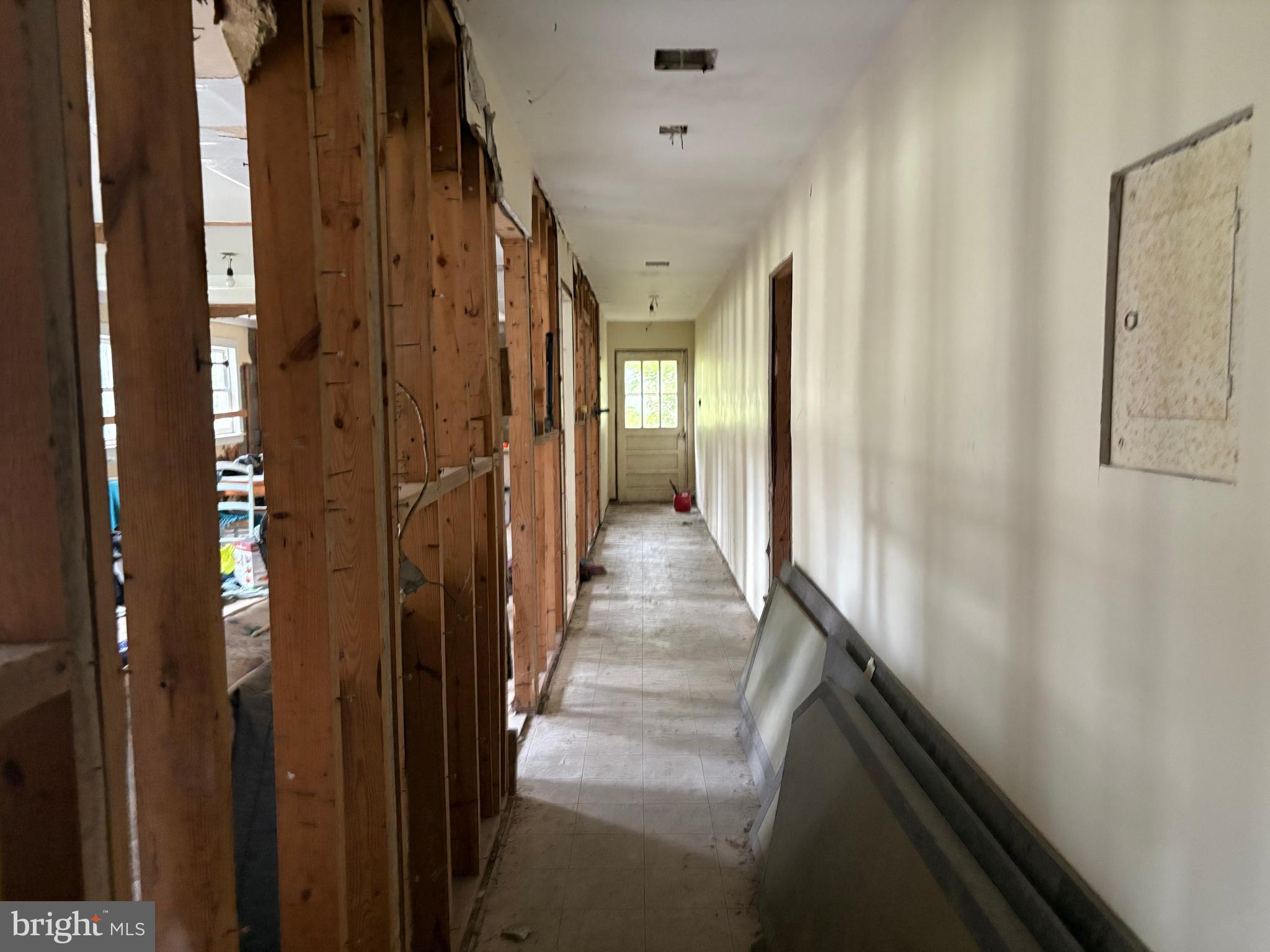 309 South Main Street Hurlock, MD 21643 - Photo 41 of 53 a view of a hallway with wooden floor and staircase