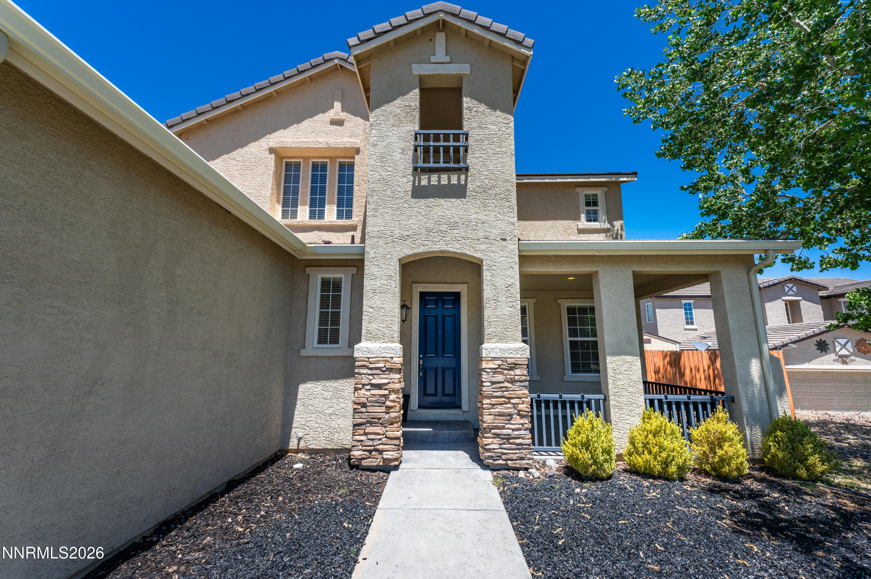 1770 Kodiak Circle Reno, NV 89511 - Photo 2 of 32 a front view of a house with garden