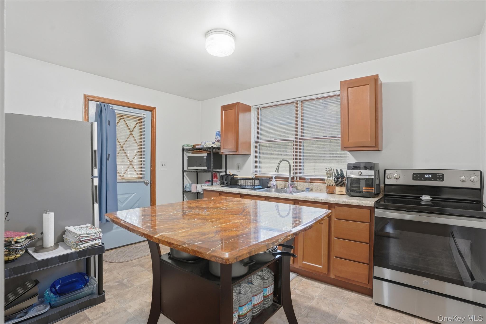 6 Short Road Wurtsboro, NY 12790 - Photo 21 of 48 a kitchen with a stove a sink and a refrigerator
