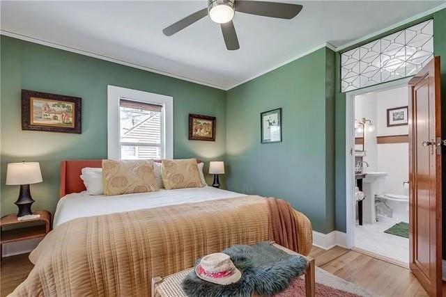 3353 Myrtle Street Hapeville, GA 30354 - Photo 9 of 22 a bedroom with a bed and a chandelier