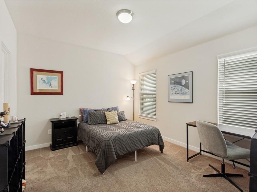 10613 Smiths Bnd Road Fort Worth, TX 76126 - Photo 15 of 29 Carpeted room featuring two windows with horizontal blinds, a neutral color palette, and a semi-flush mount ceiling light fixture