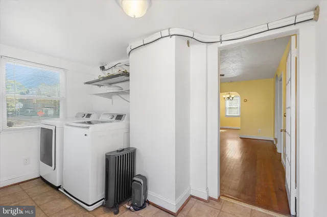 a view of bathroom with a tub and shower