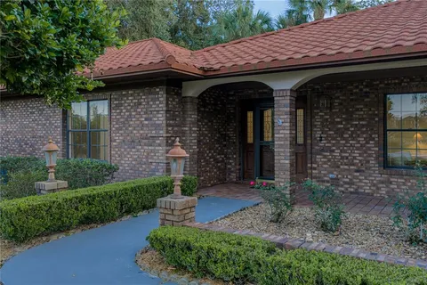 a view of a wooden door of the house