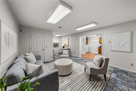 a workspace with furniture and a flat screen tv