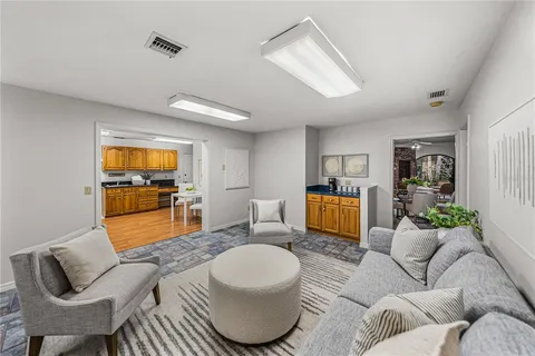 a kitchen with stainless steel appliances granite countertop a stove a sink and a microwave