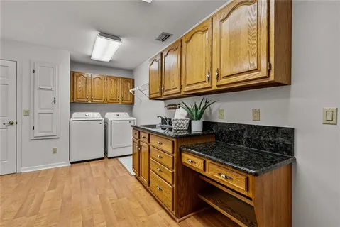 a view of a porch with furniture and floor to ceiling window