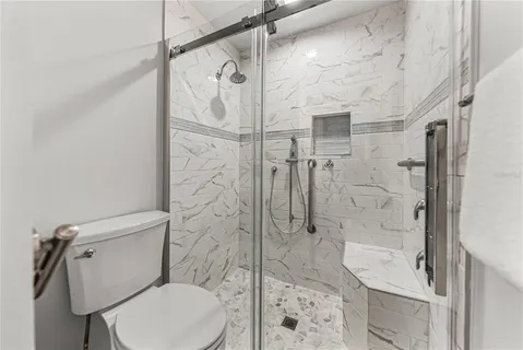 a view of a house with backyard and garden