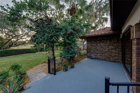 a front view of a house with a garden and yard