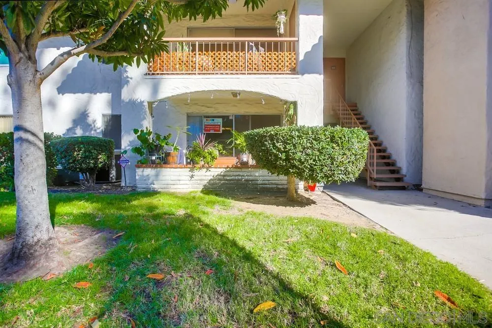 5999 Rancho Mission Road, Unit 117 San Diego, CA 92108 - Photo 5 of 5 a view of a building with a yard