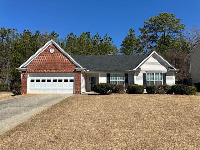 50 Cold Springs Court Covington, GA 30016 - Photo 1 of 1 a front view of a house with a yard and garage