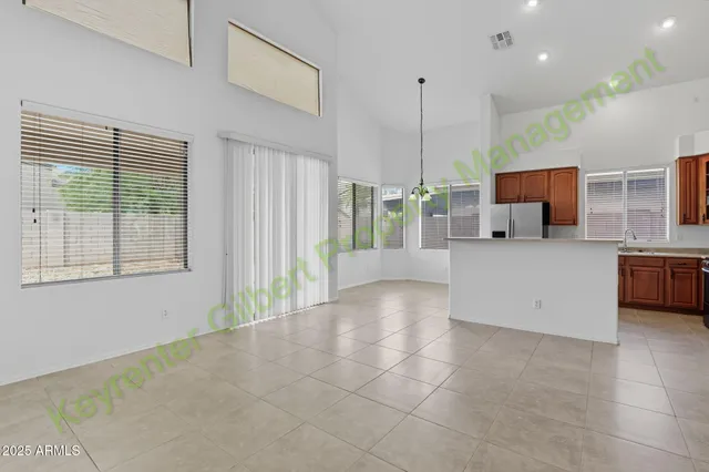 a view of an empty room with stairs and a fireplace