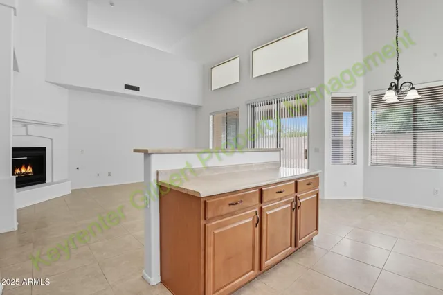a kitchen with a refrigerator and a stove