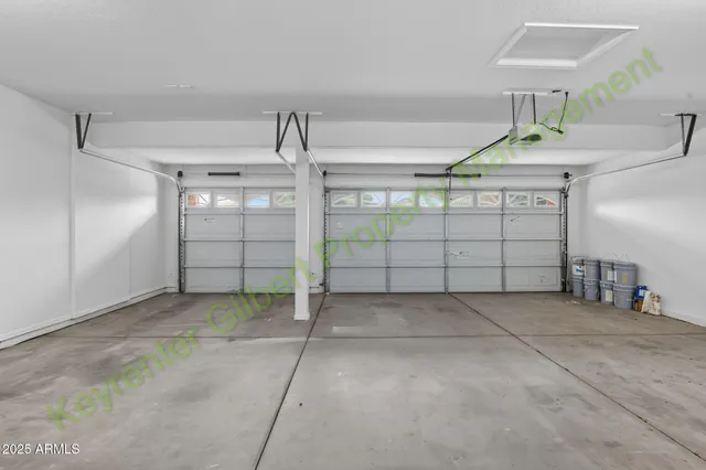 a bathroom with a sink a toilet a mirror and shower