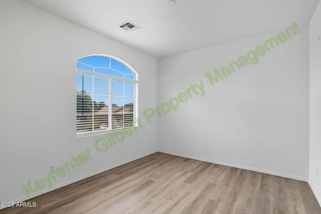 a bathroom with a sink double vanity mirror and a bathtub
