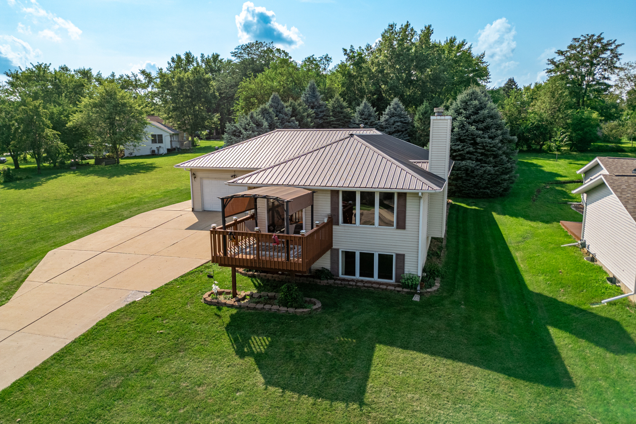 a view of a house with a yard porch and sitting area
