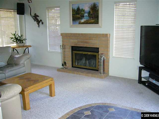 2742 Azuza Way Reno, NV 89502 - Photo 5 of 9 a living room with furniture and a fireplace