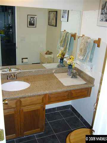 2742 Azuza Way Reno, NV 89502 - Photo 6 of 9 a bathroom with a sink and a mirror