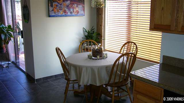 2742 Azuza Way Reno, NV 89502 - Photo 7 of 9 a view of a dining room with furniture and wooden floor
