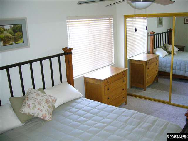 2742 Azuza Way Reno, NV 89502 - Photo 9 of 9 a bedroom with a bed and wooden floor