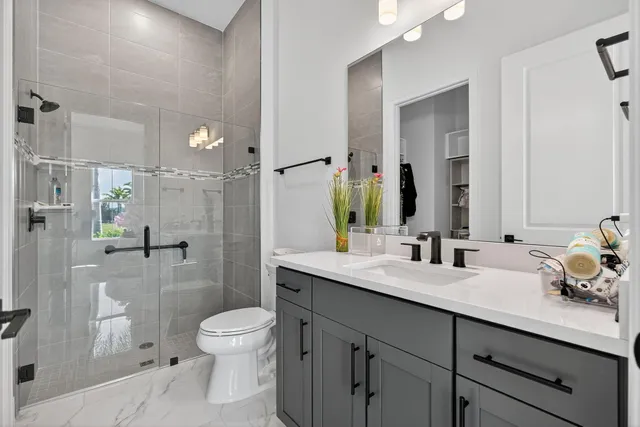 a view of a lake with houses in the background