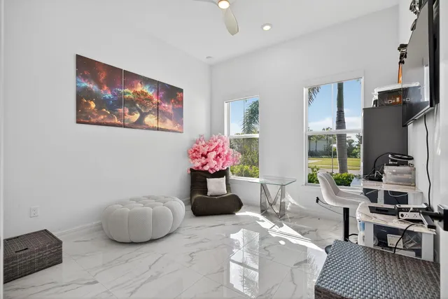 a view of a dining room with furniture window and outside view