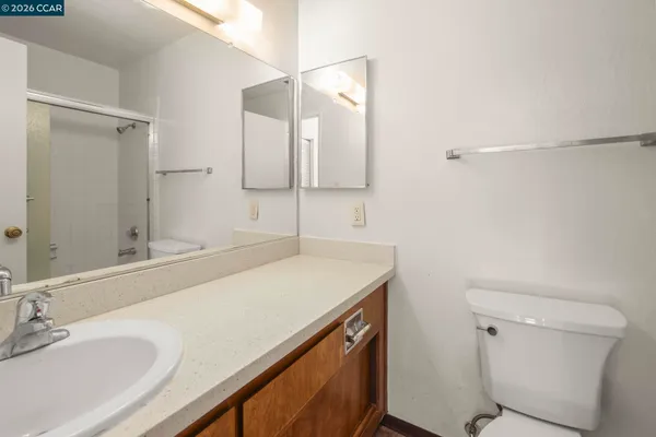 a view of a bathroom from a hallway
