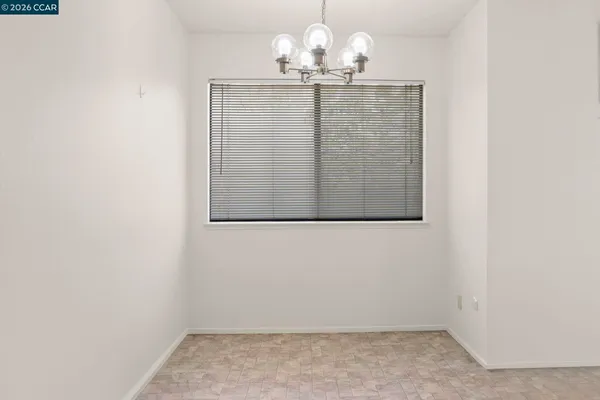 a white stove top oven sitting inside of a kitchen