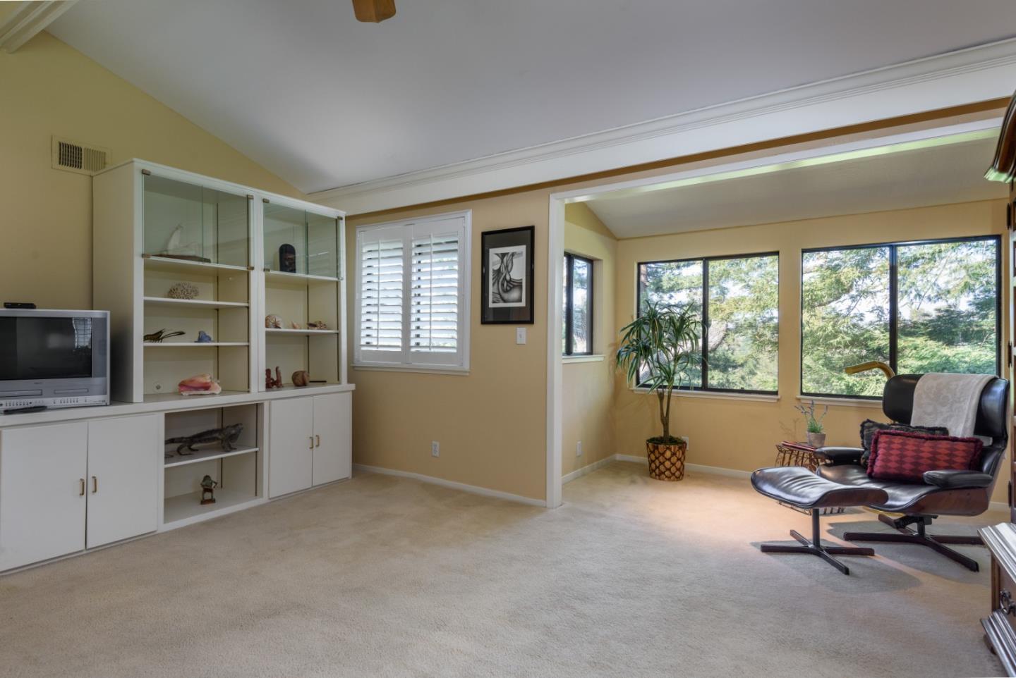 420 Sand Hill Circle Menlo Park, CA 94025 - Photo 15 of 29 a living room with furniture and a flat screen tv